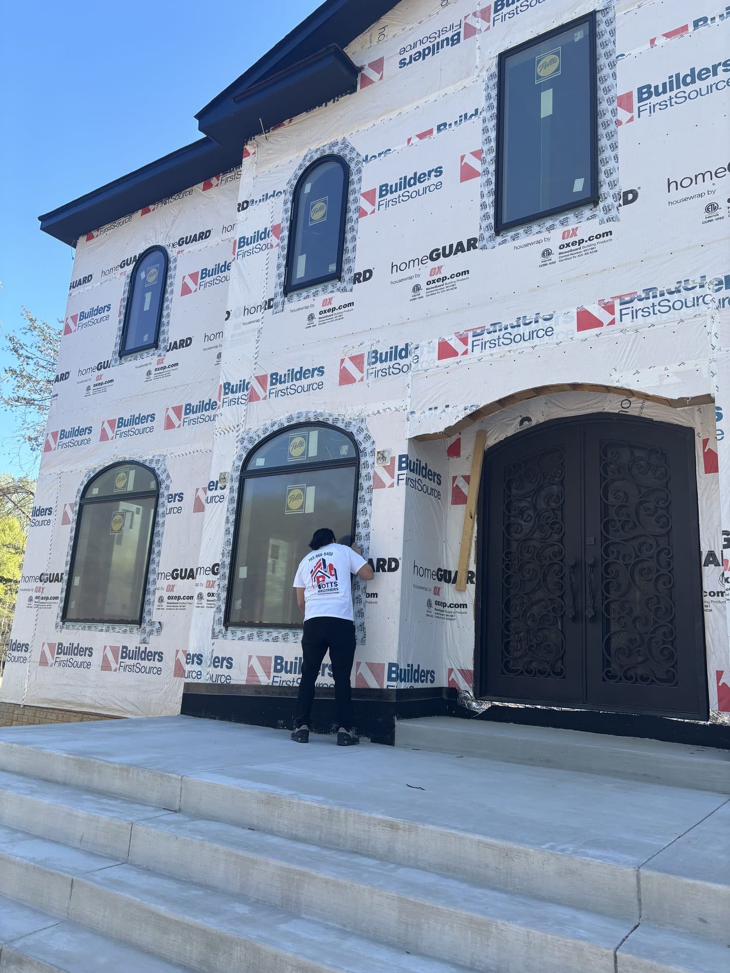 Custom home exterior with house wrap and ornate. Home addition project by Potts Brothers Construction, Arlington & Northern Virginia