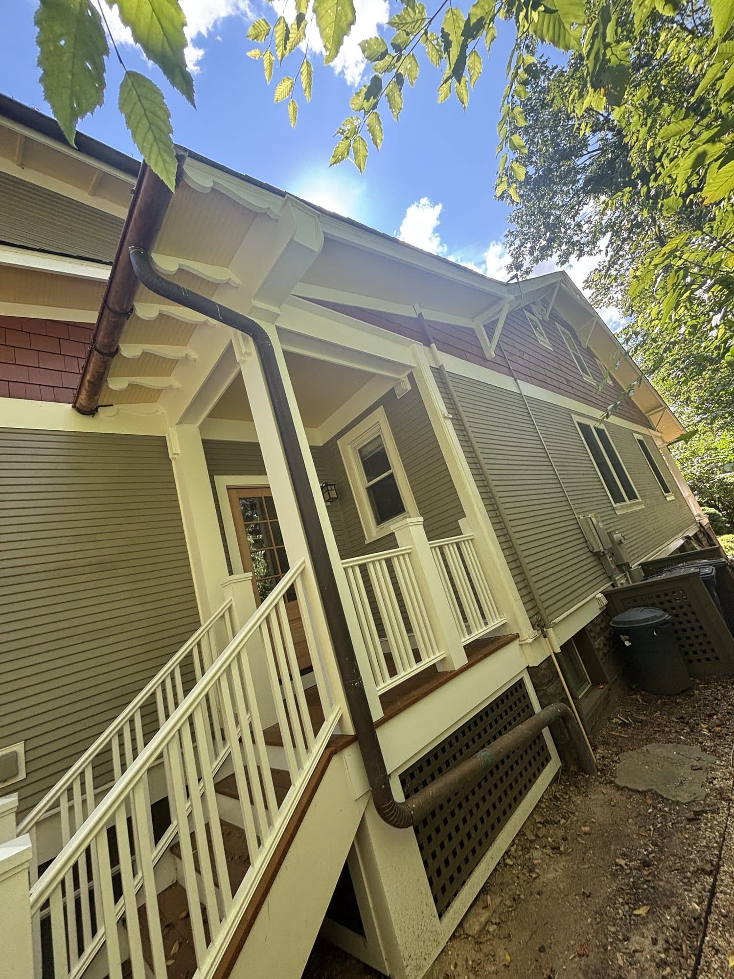 Exterior view of finished porch and home side. Home addition project by Potts Brothers Construction, Arlington & Northern Virginia