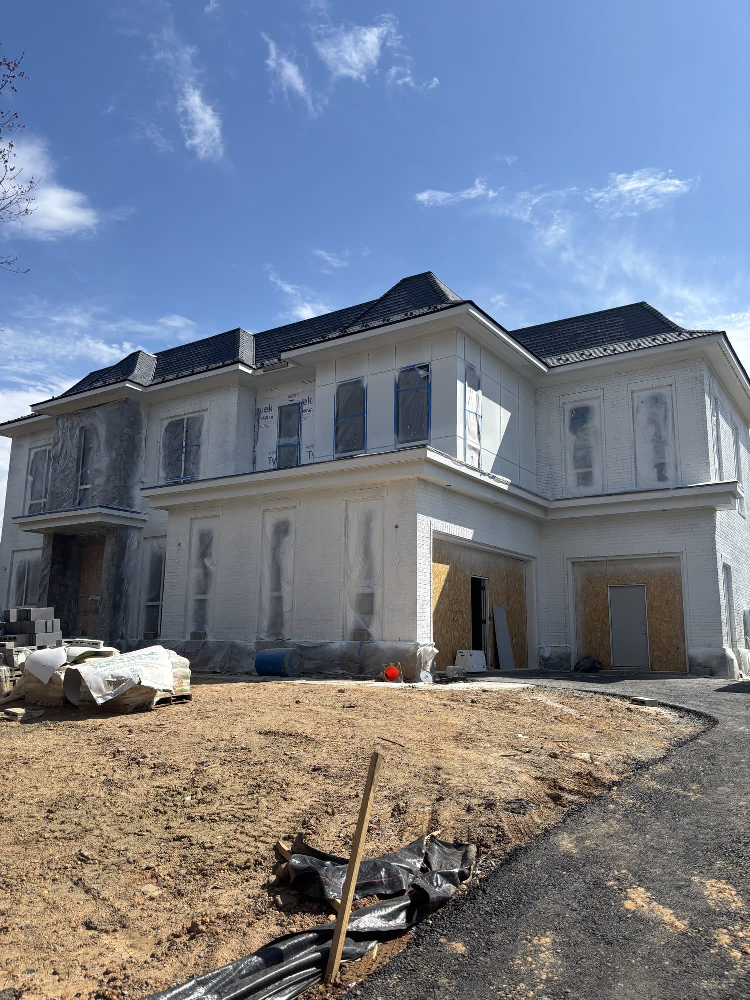 Front elevation of large custom home under const. Home addition project by Potts Brothers Construction, Arlington & Northern Virginia