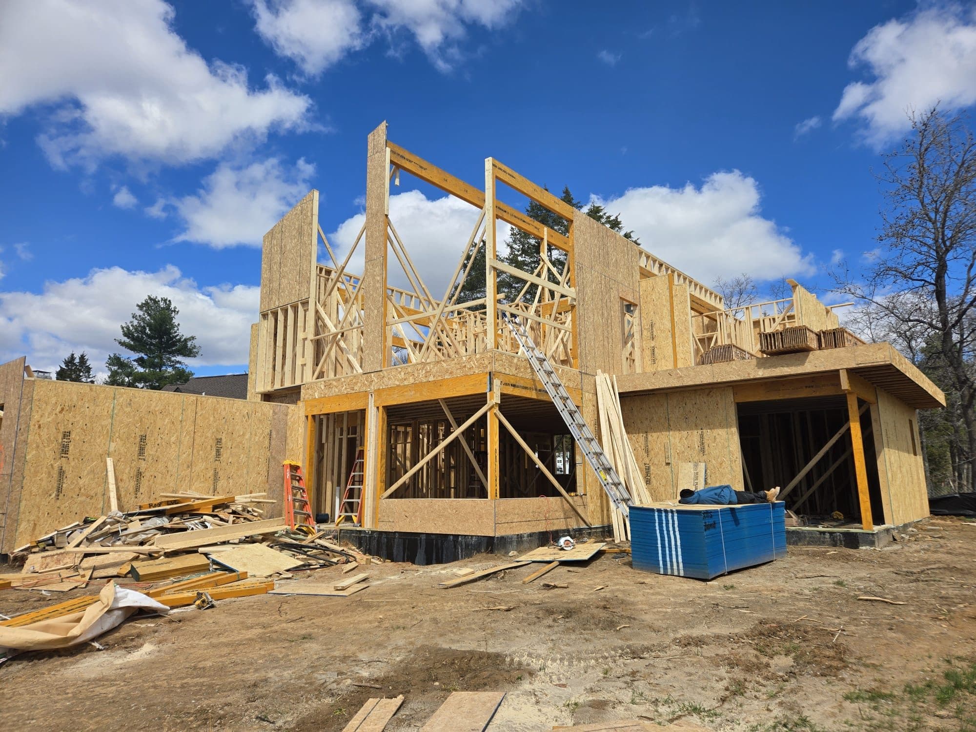Large two story home framing with attached garag. Home addition project by Potts Brothers Construction, Arlington & Northern Virginia