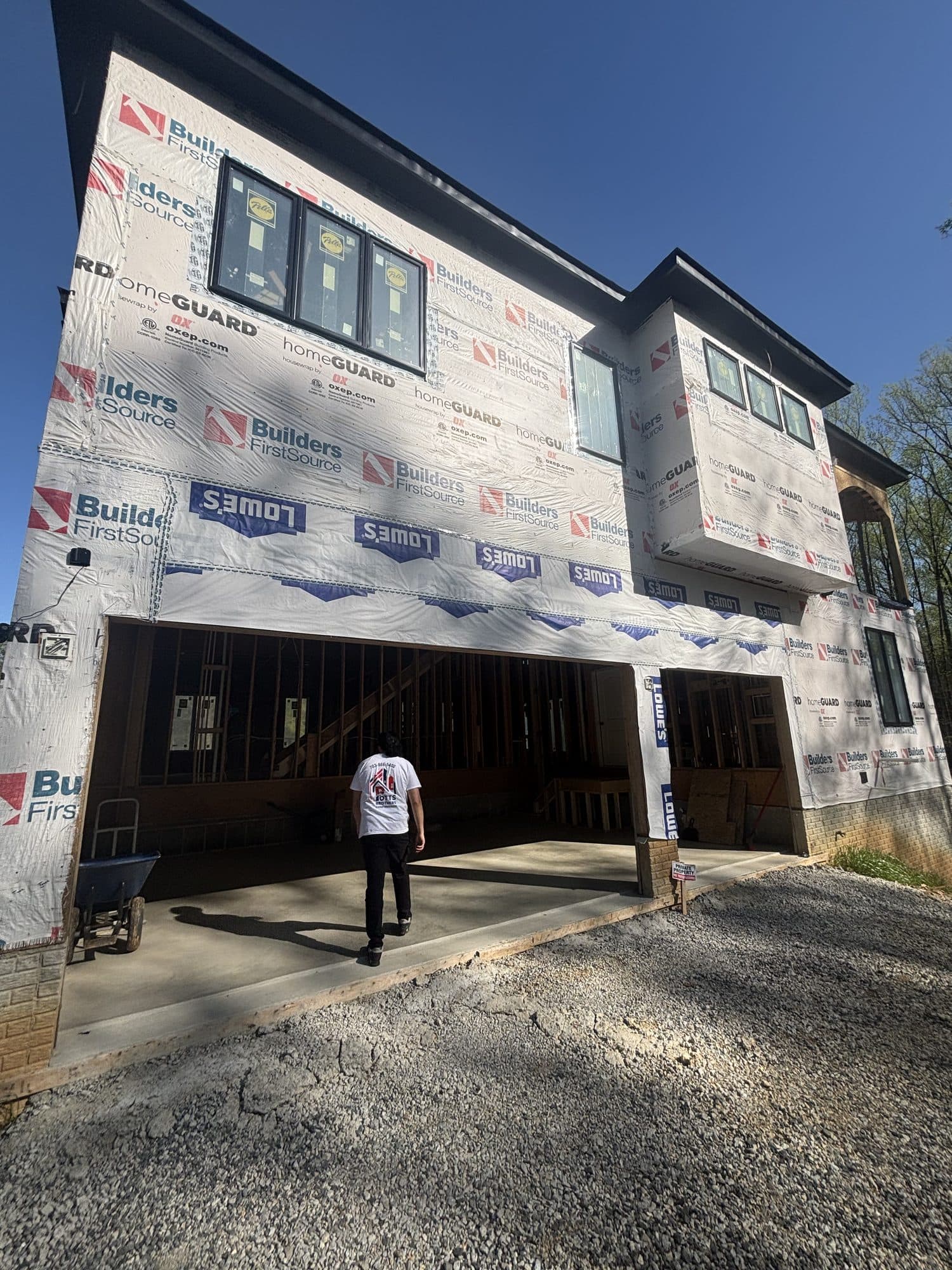 Modern home under construction with double garag. Home addition project by Potts Brothers Construction, Arlington & Northern Virginia