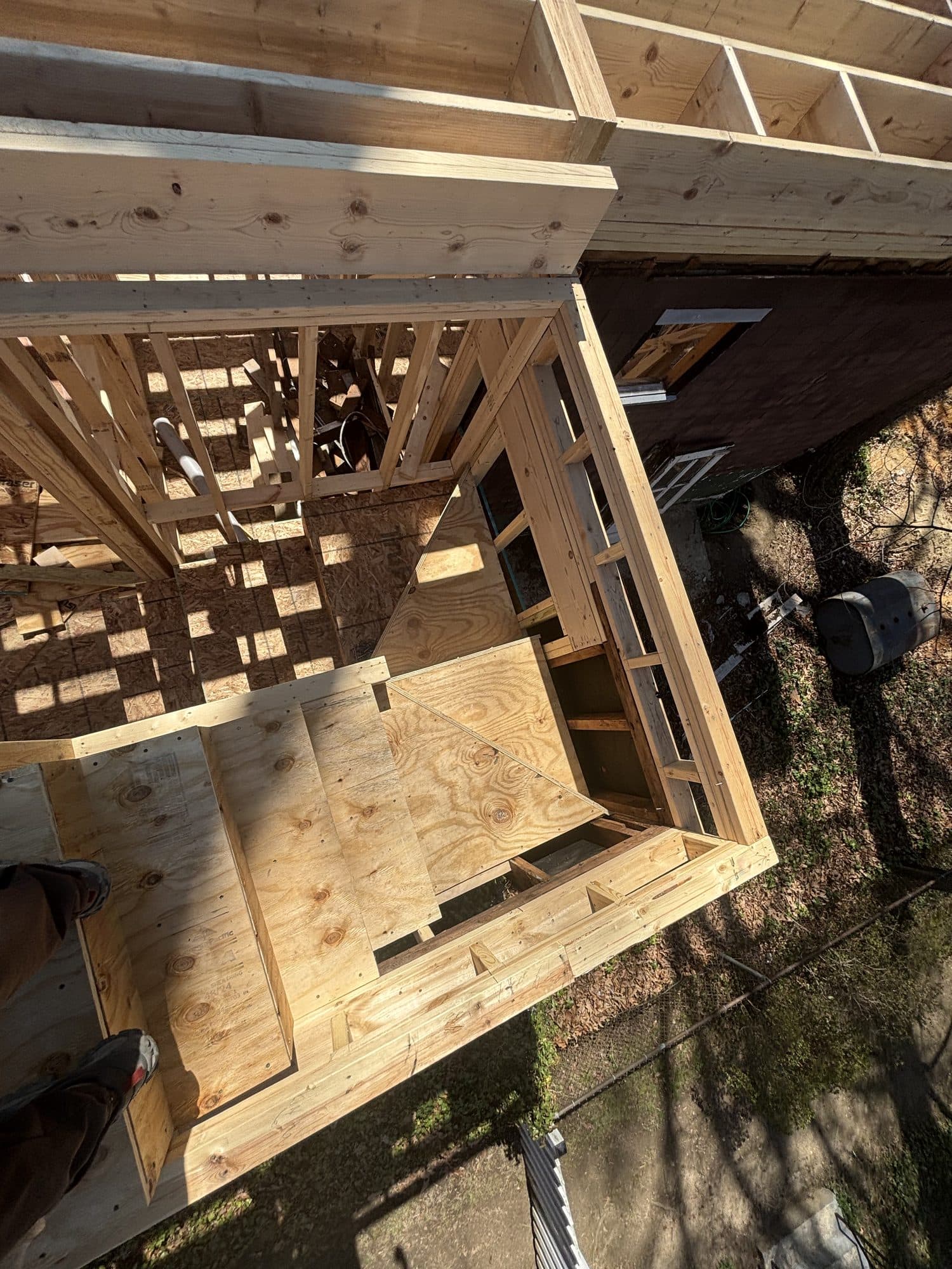 Overhead view of addition framing and subfloor. Home addition project by Potts Brothers Construction, Arlington & Northern Virginia