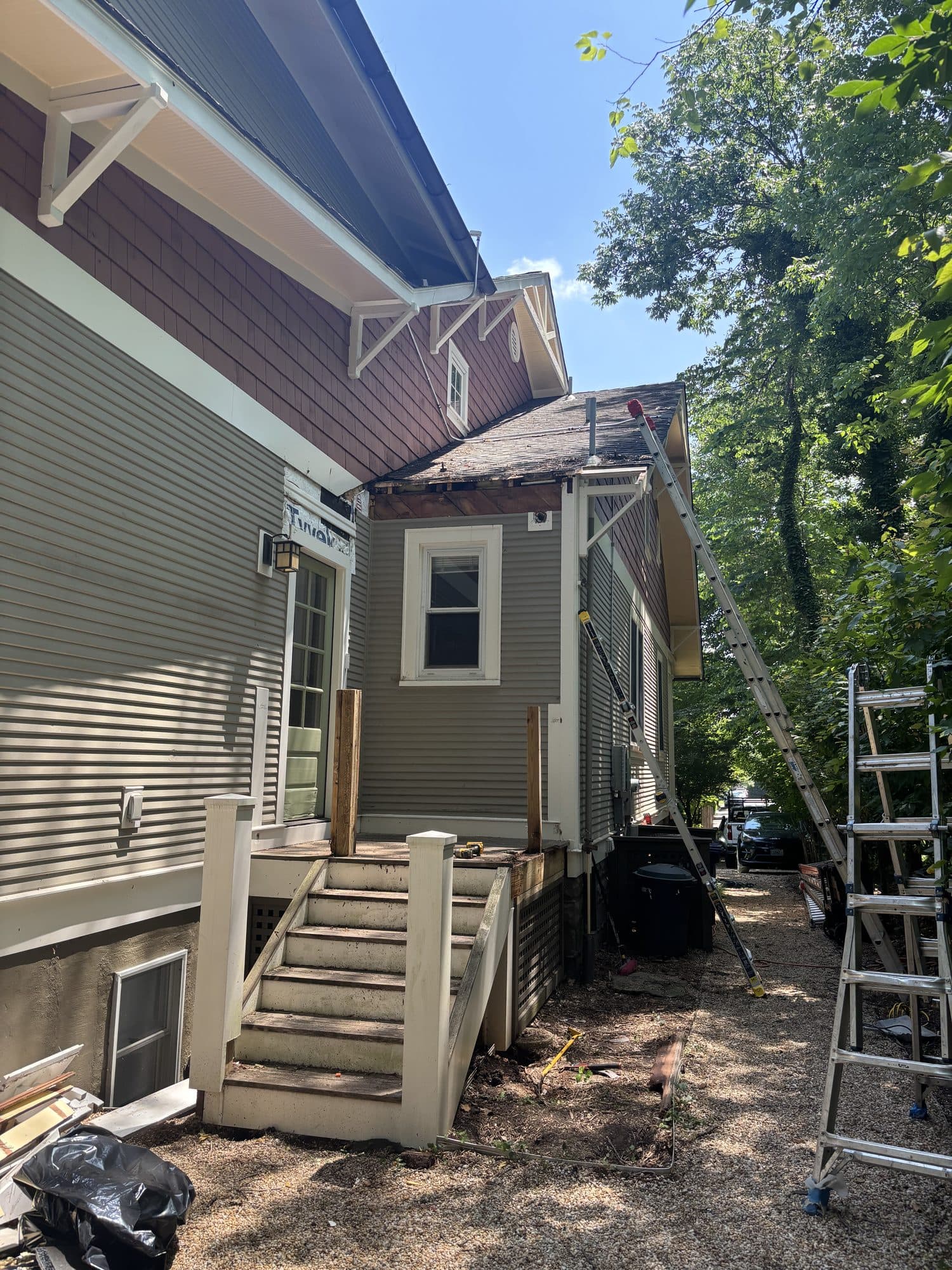 Rear addition framing with deck steps and ladder. Home addition project by Potts Brothers Construction, Arlington & Northern Virginia