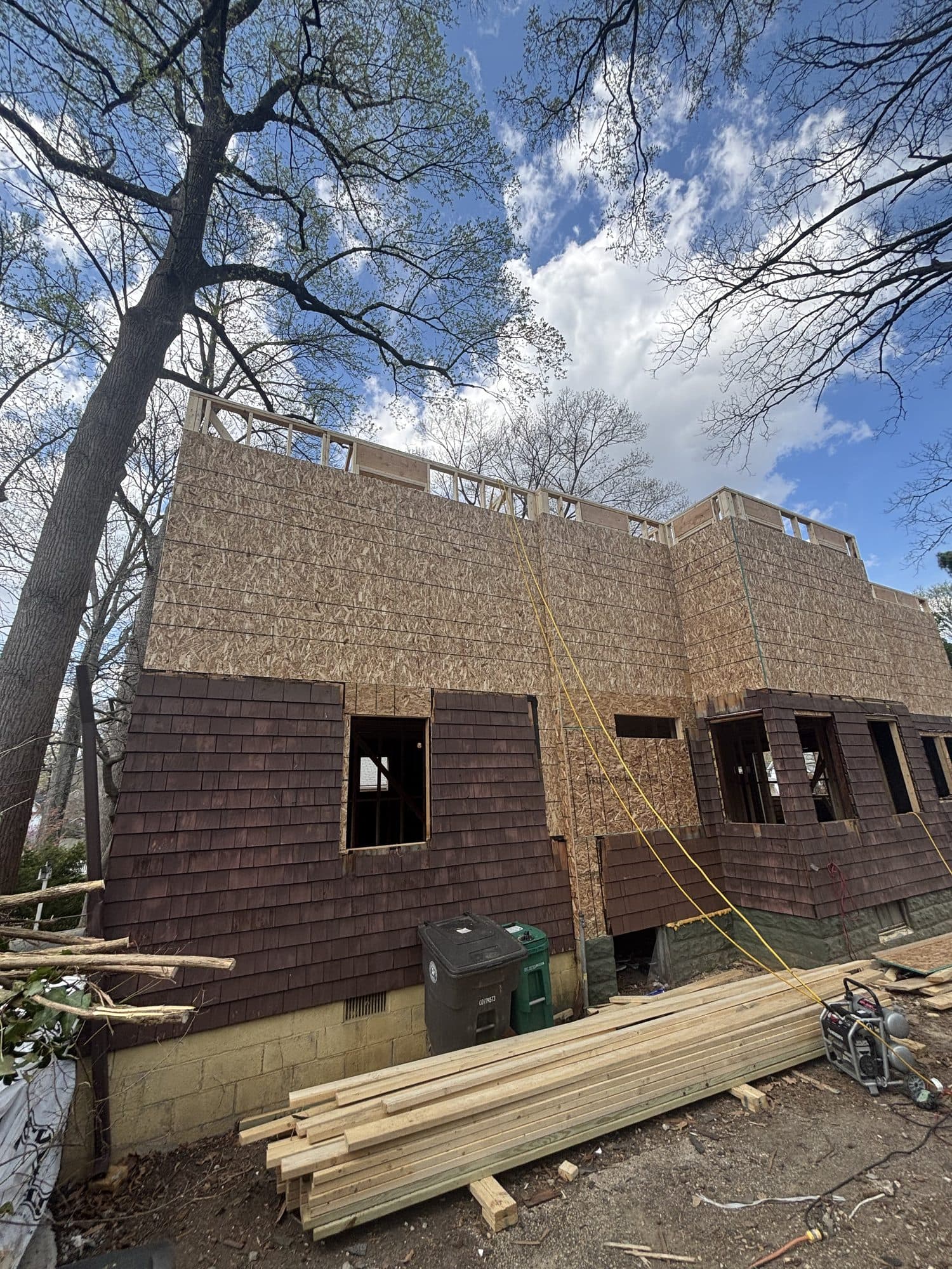 Sheathed two story home addition exterior under. Home addition project by Potts Brothers Construction, Arlington & Northern Virginia