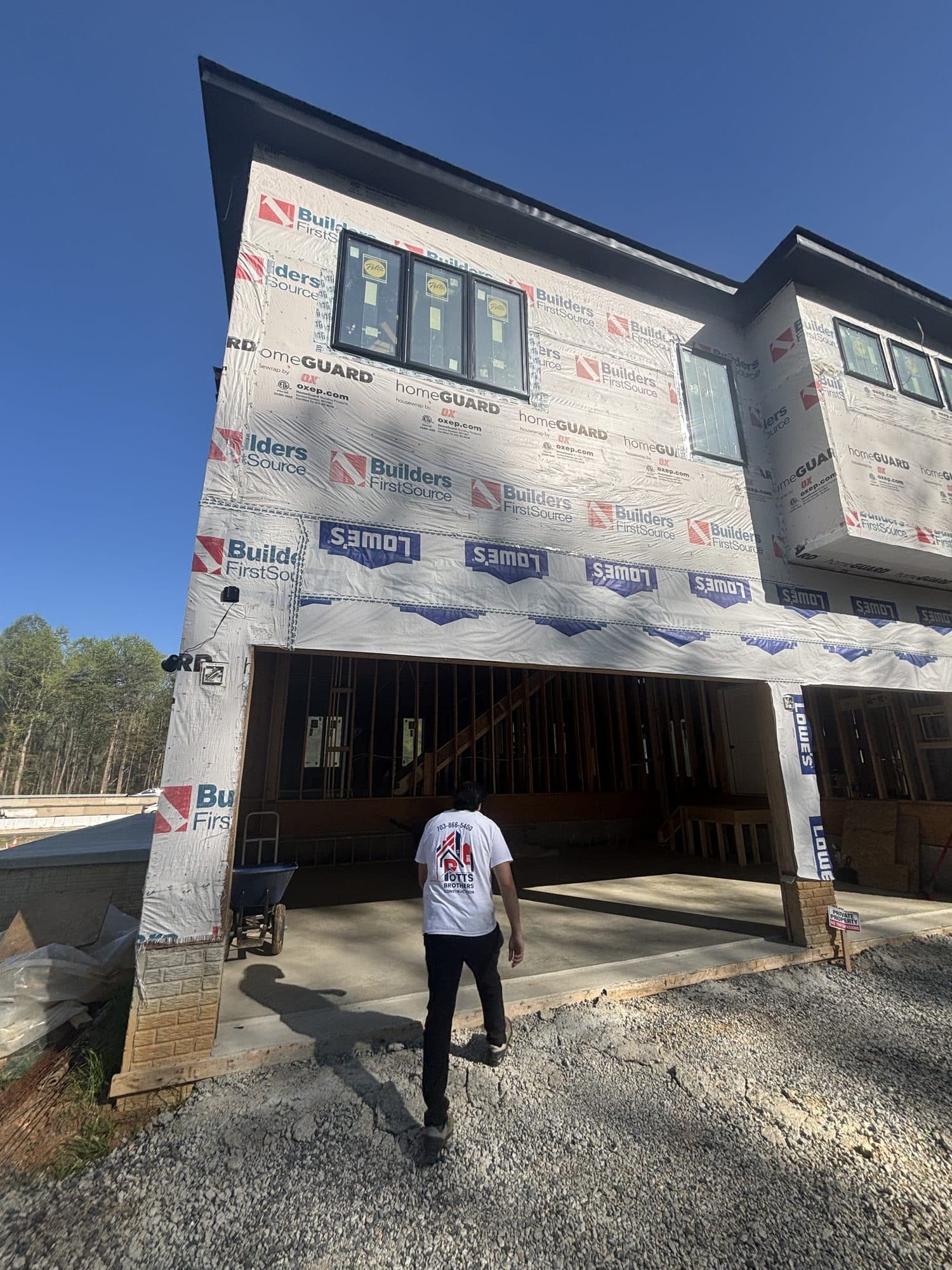 Three story home under construction with garage. Home addition project by Potts Brothers Construction, Arlington & Northern Virginia