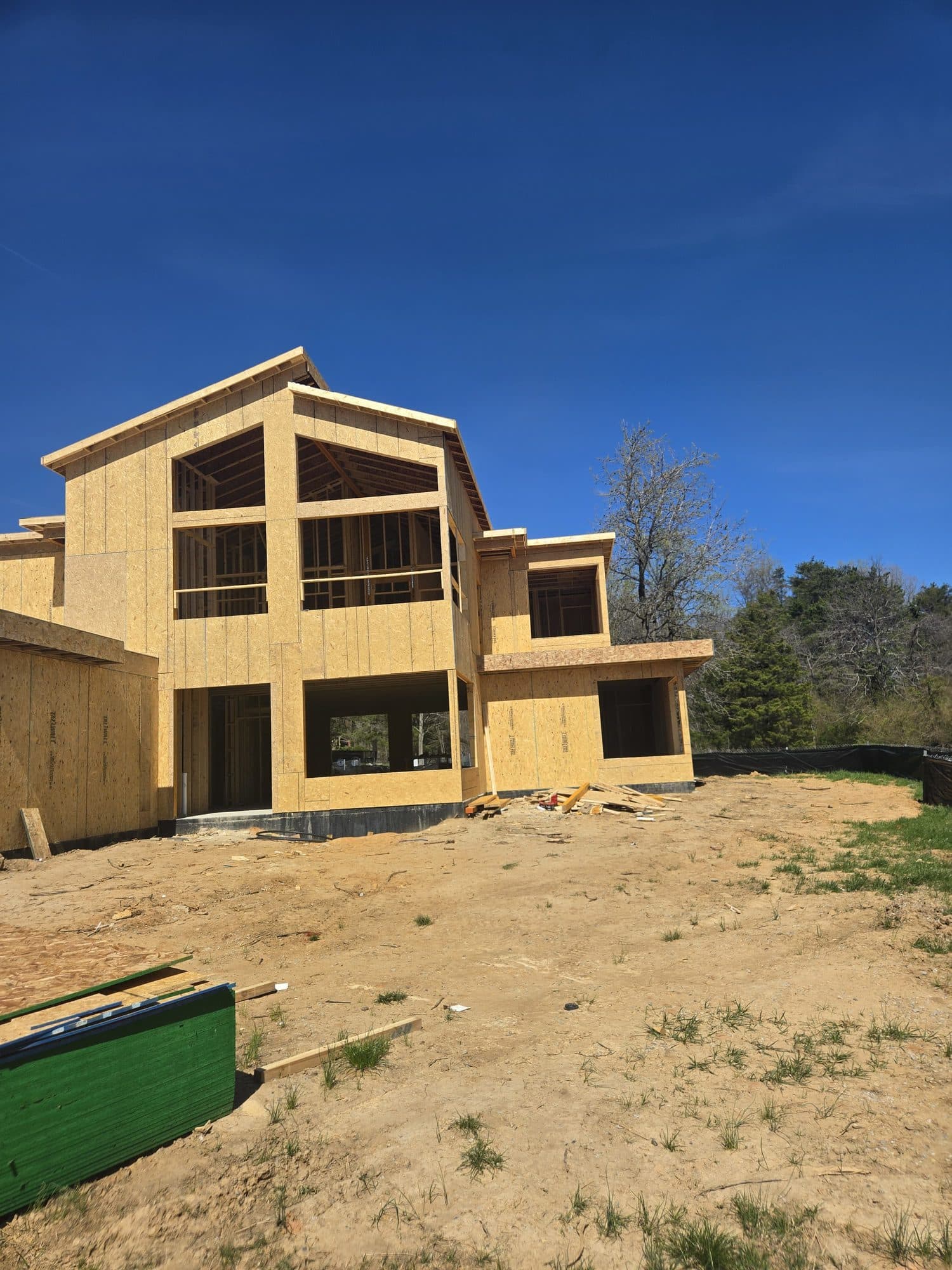 Two story home framed and sheathed with large. Home addition project by Potts Brothers Construction, Arlington & Northern Virginia