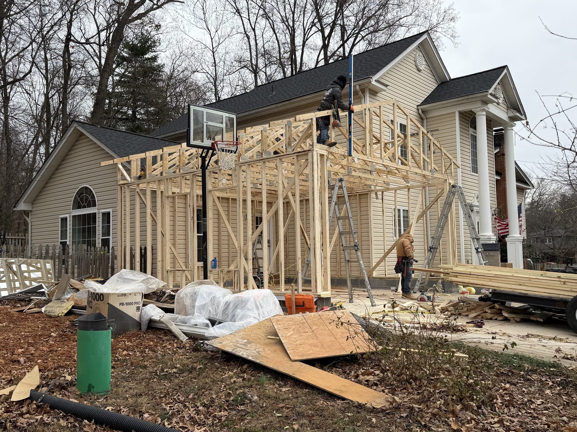 Workers framing two story addition wide shot. Home addition project by Potts Brothers Construction, Arlington & Northern Virginia