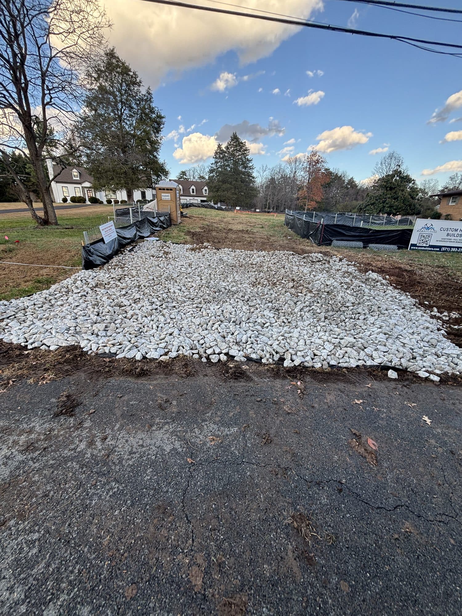 Compacted gravel base pad on cleared residential. Concrete project by Potts Brothers Construction, Arlington & Northern Virginia