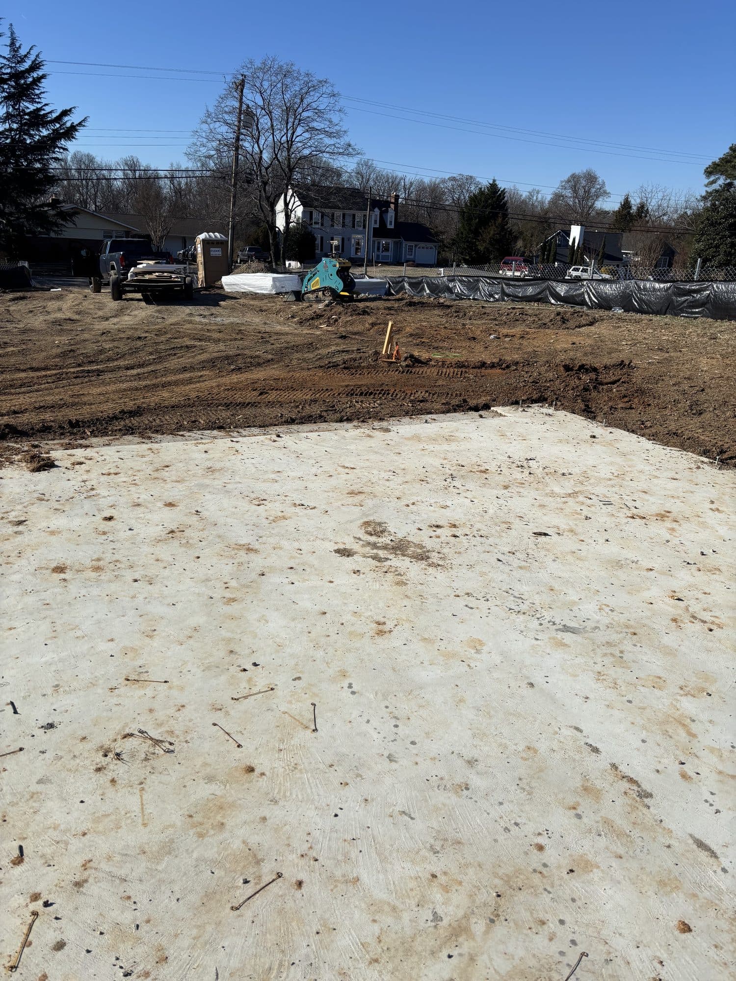 Concrete slab with equipment and street behind. Concrete project by Potts Brothers Construction, Arlington & Northern Virginia
