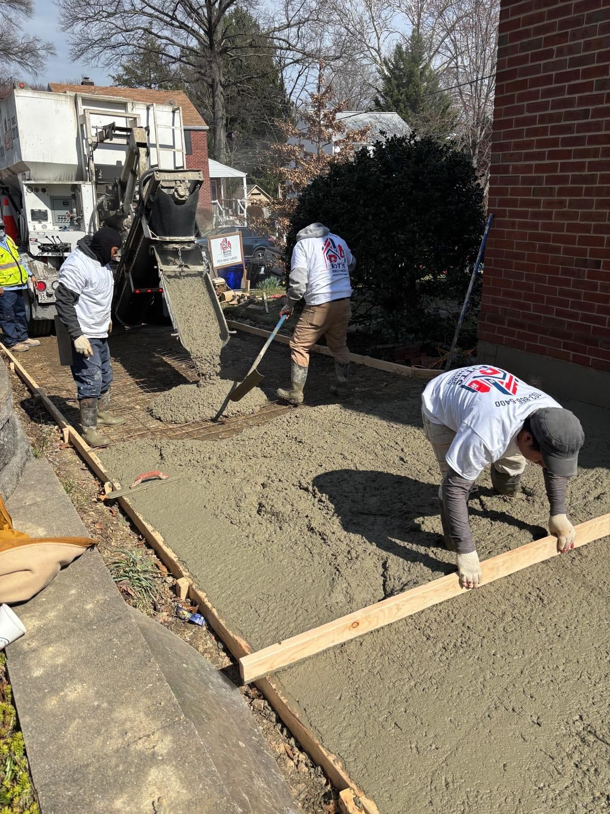 Crew floating wet concrete formed. Concrete project by Potts Brothers Construction, Arlington & Northern Virginia