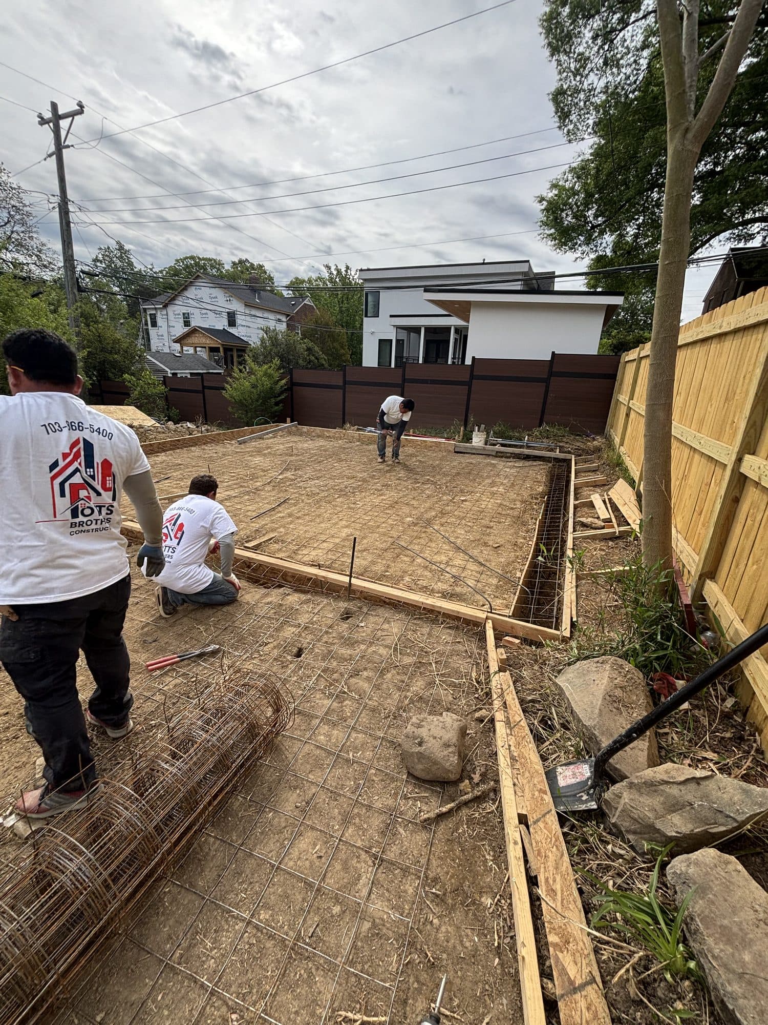 Crew forming and laying rebar for slab. Concrete project by Potts Brothers Construction, Arlington & Northern Virginia
