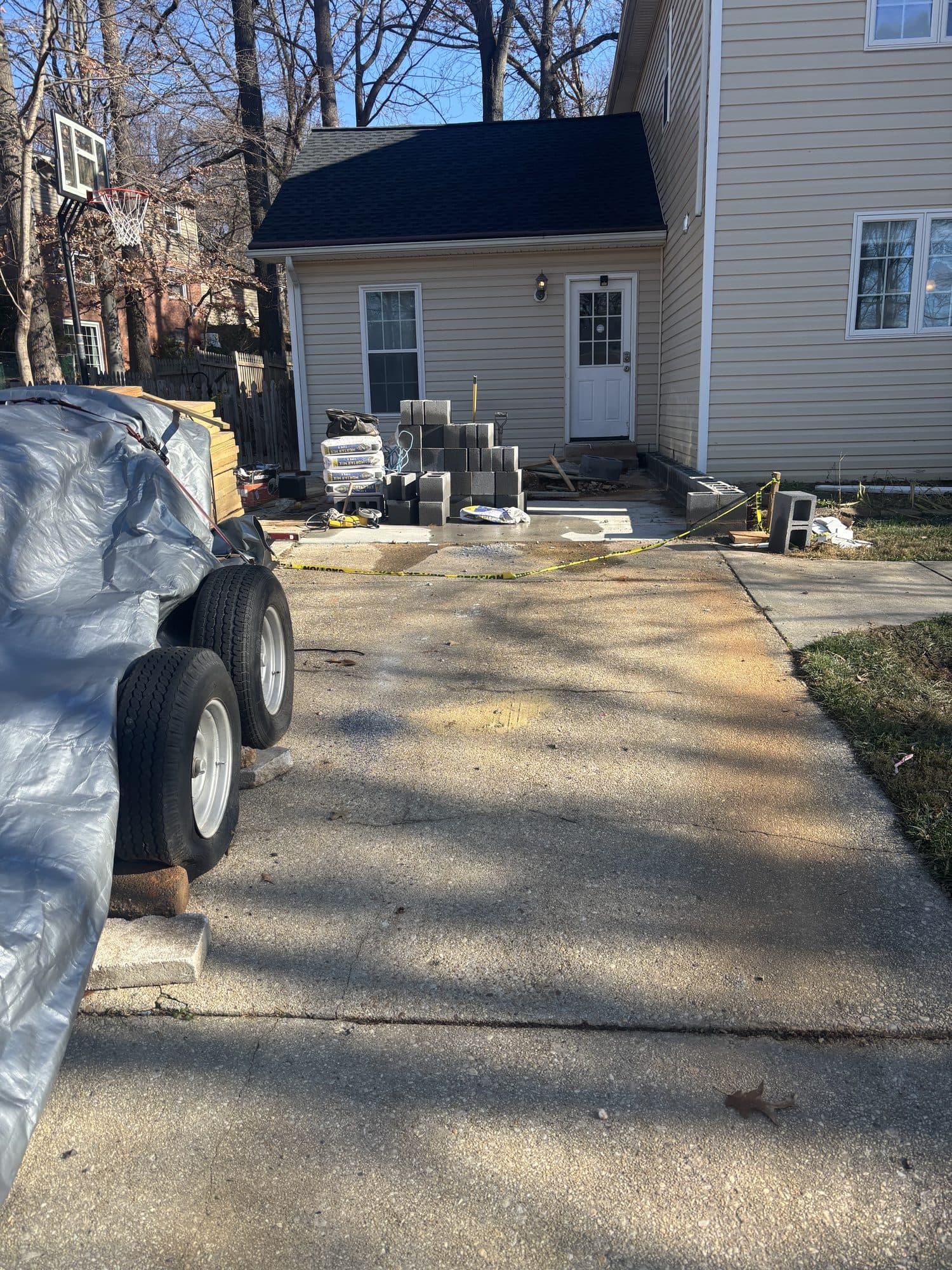 Existing concrete driveway with materials staged. Concrete project by Potts Brothers Construction, Arlington & Northern Virginia