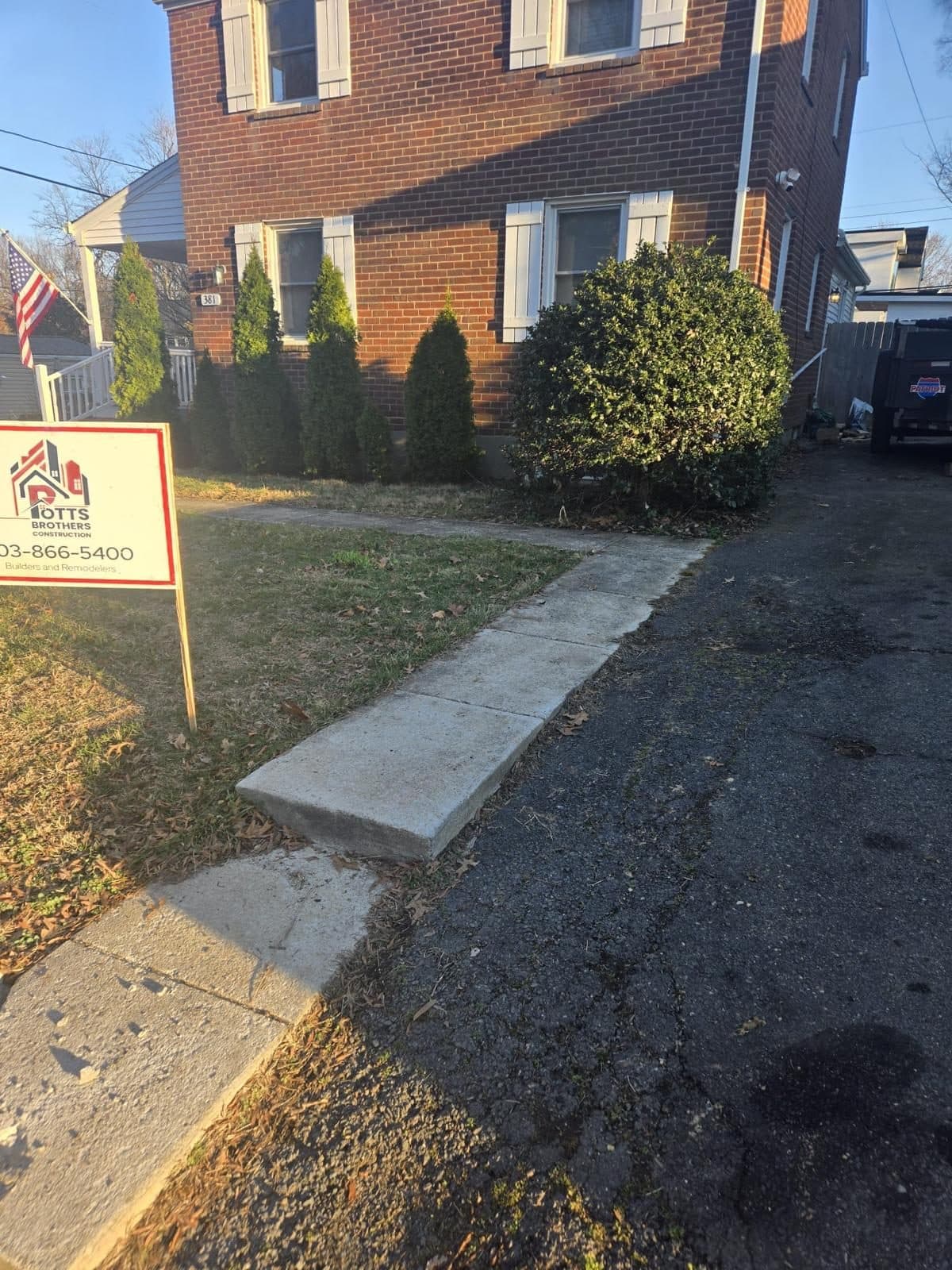 Finished concrete walkway leading brick. Concrete project by Potts Brothers Construction, Arlington & Northern Virginia