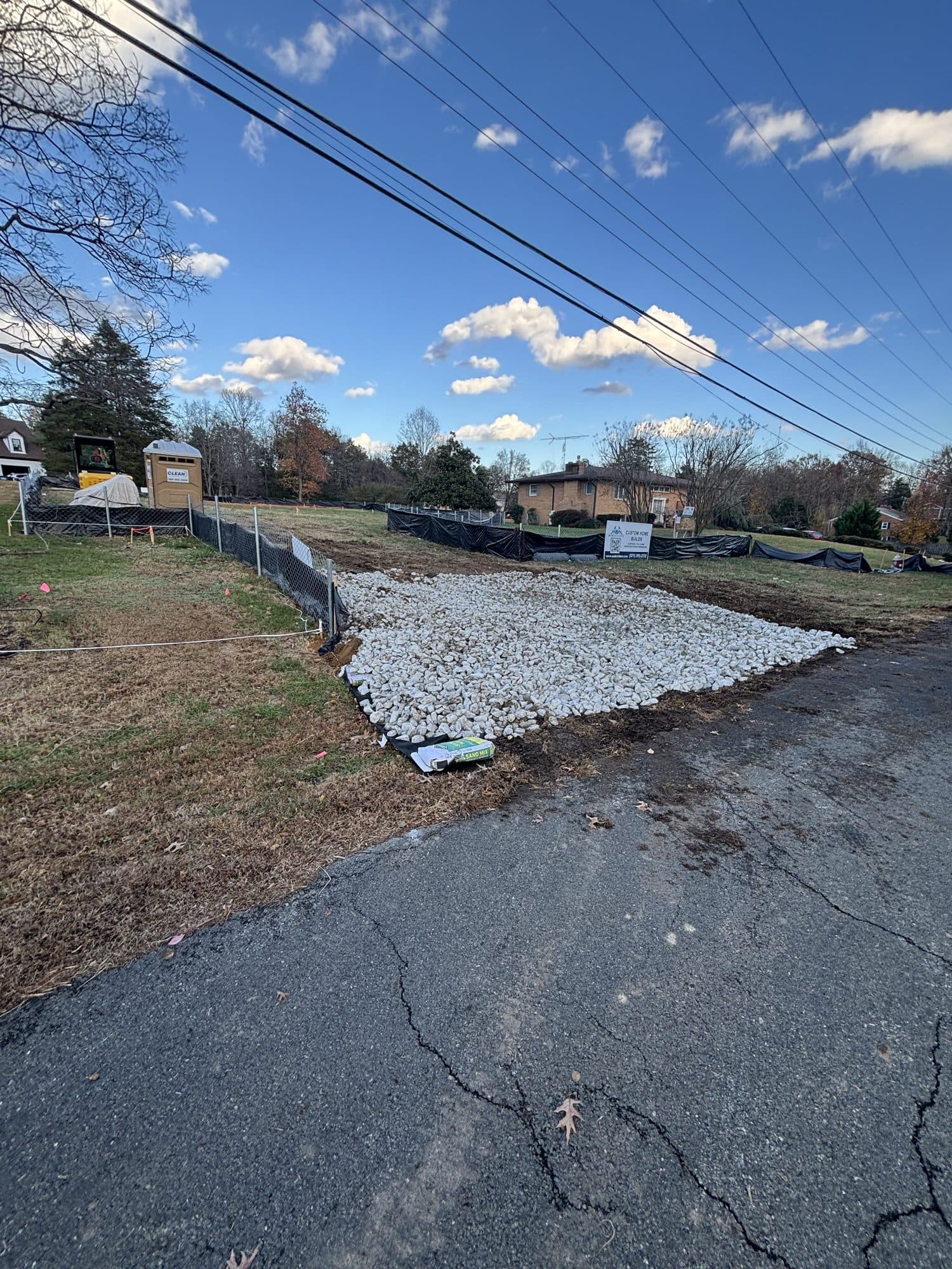 Gravel base apron at driveway entrance off road. Concrete project by Potts Brothers Construction, Arlington & Northern Virginia