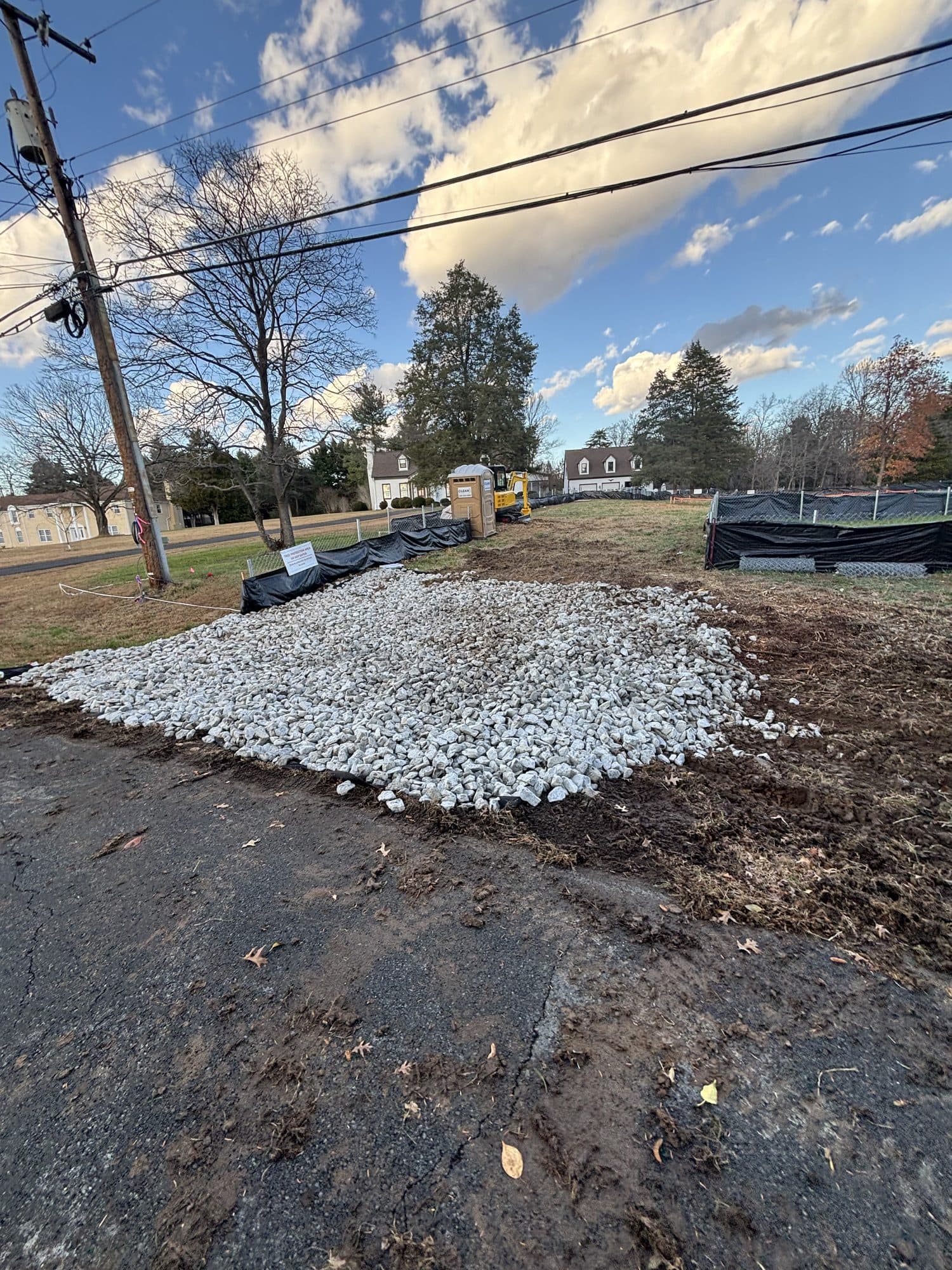 Gravel sub base pad with portable toilet and sit. Concrete project by Potts Brothers Construction, Arlington & Northern Virginia