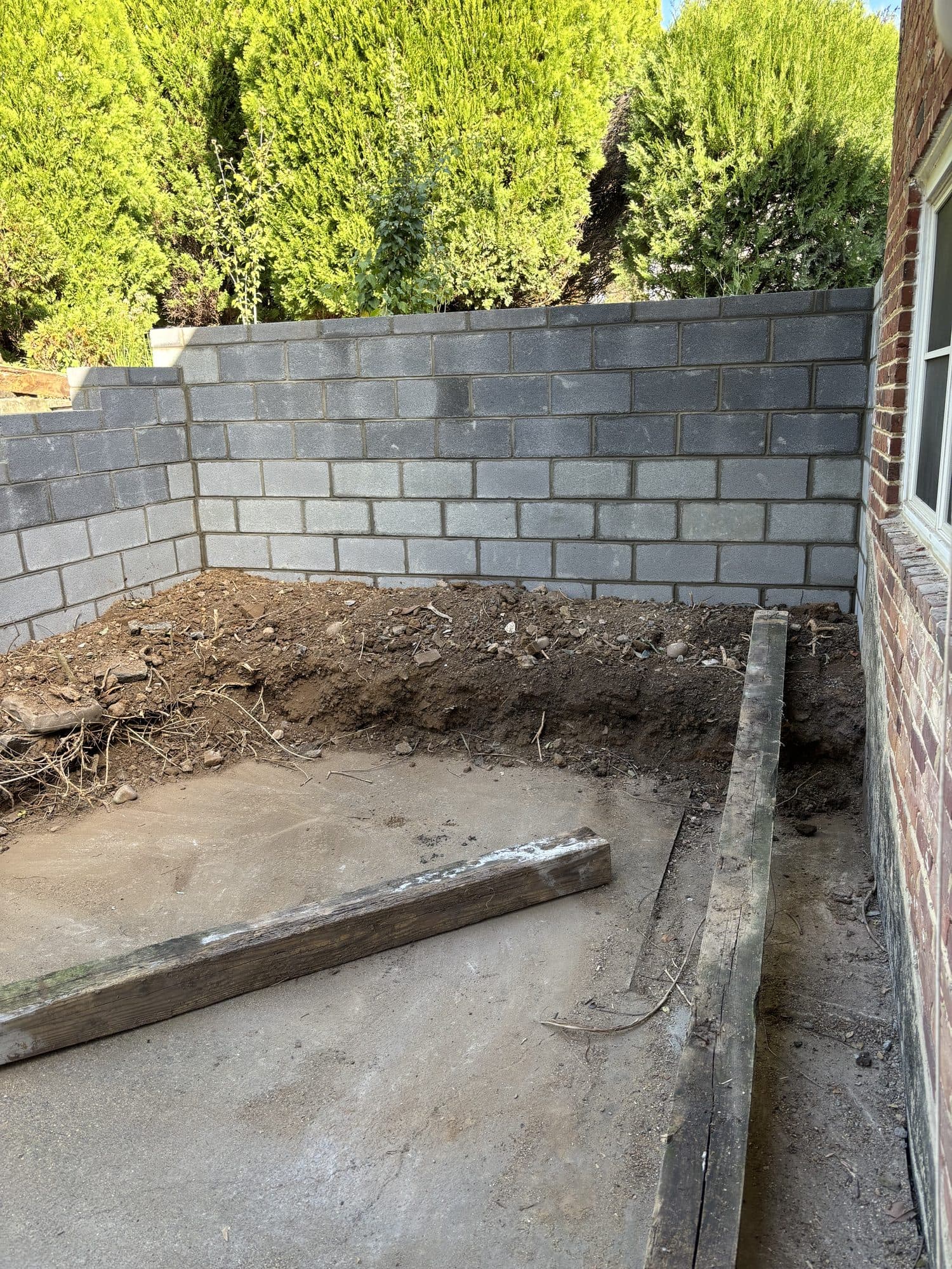 New cinder block retaining wall. Concrete project by Potts Brothers Construction, Arlington & Northern Virginia