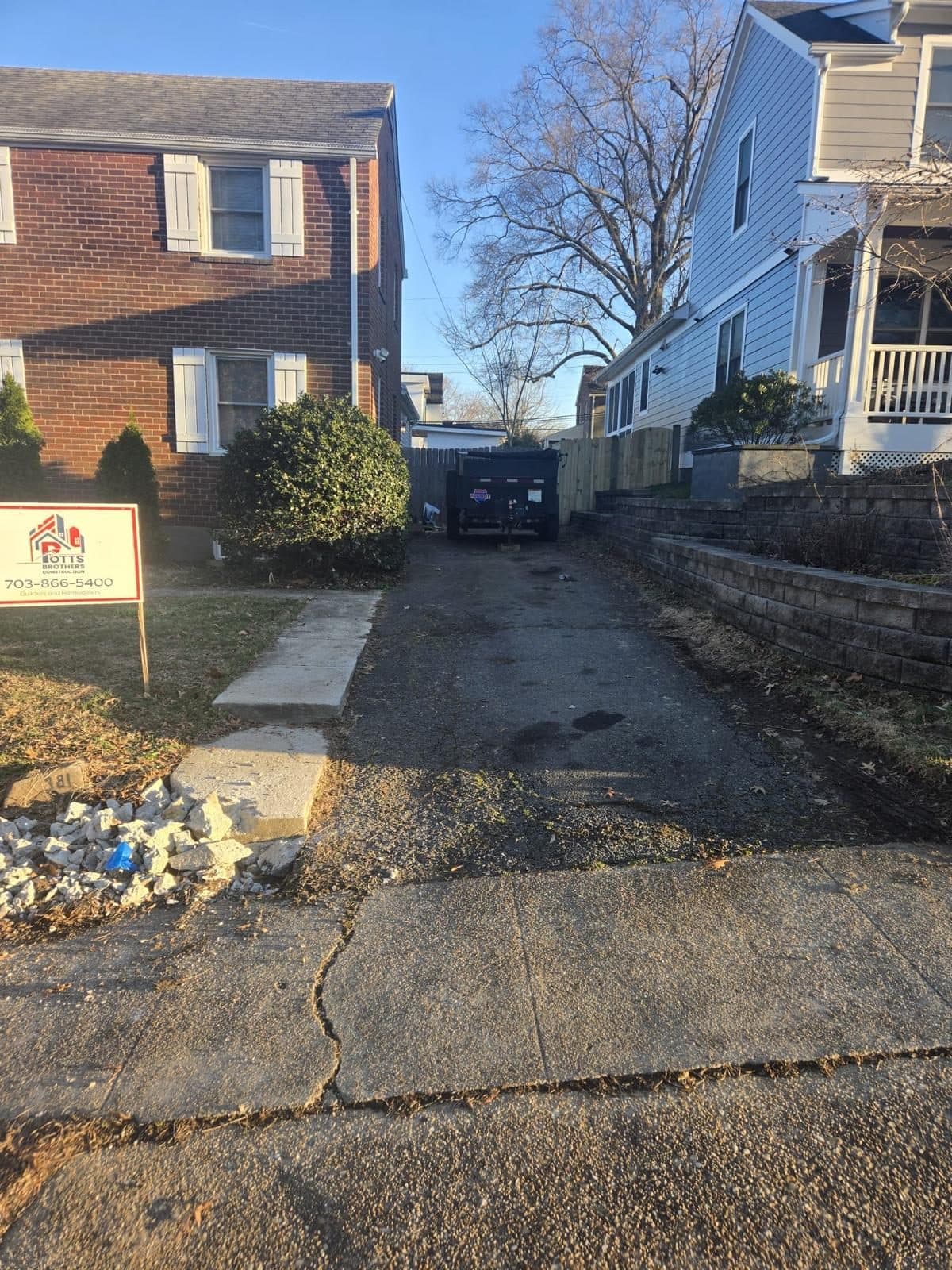 Side driveway between two houses. Concrete project by Potts Brothers Construction, Arlington & Northern Virginia