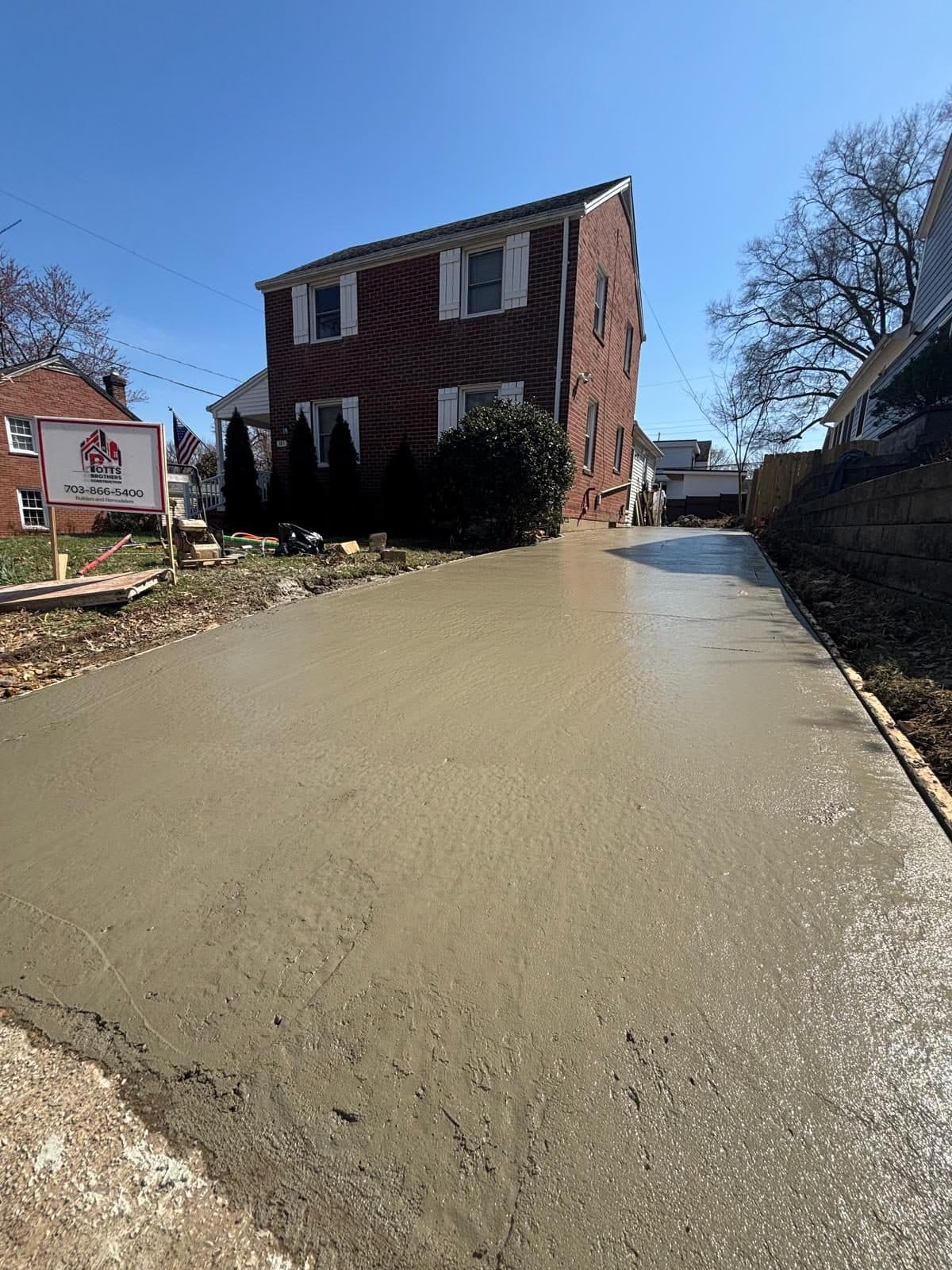 Wet poured concrete driveway front. Concrete project by Potts Brothers Construction, Arlington & Northern Virginia