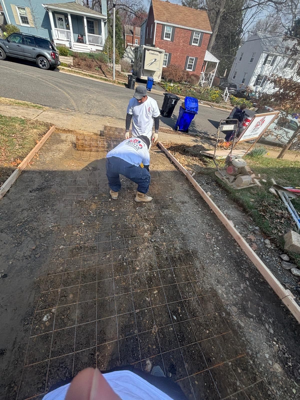Workers setting wire mesh forms. Concrete project by Potts Brothers Construction, Arlington & Northern Virginia