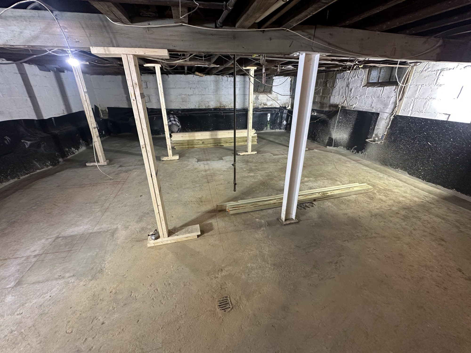 Crawlspace with poured slab and support columns. Foundation project by Potts Brothers Construction, Arlington & Northern Virginia