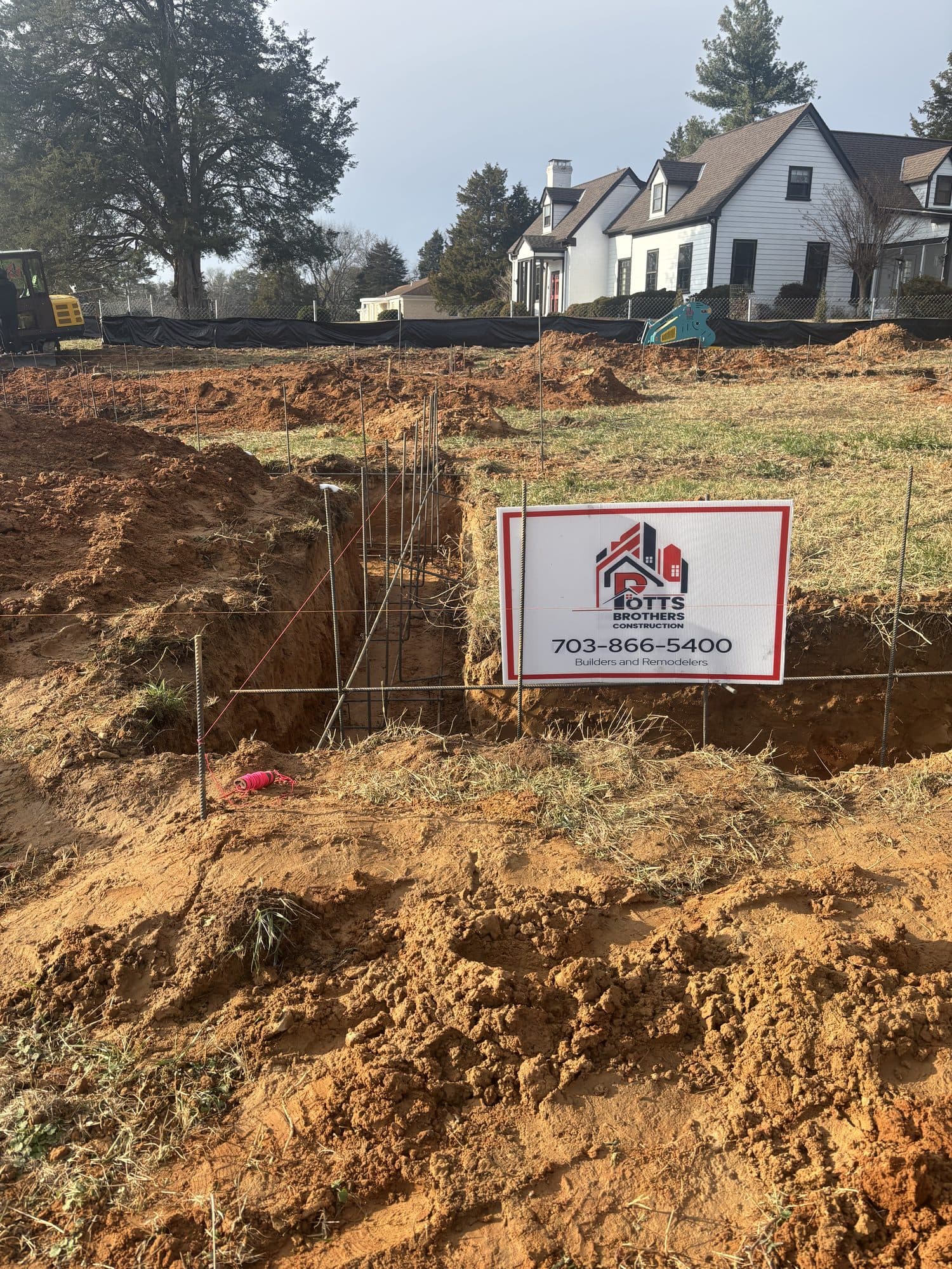Excavated footing trenches construction site. Foundation project by Potts Brothers Construction, Arlington & Northern Virginia