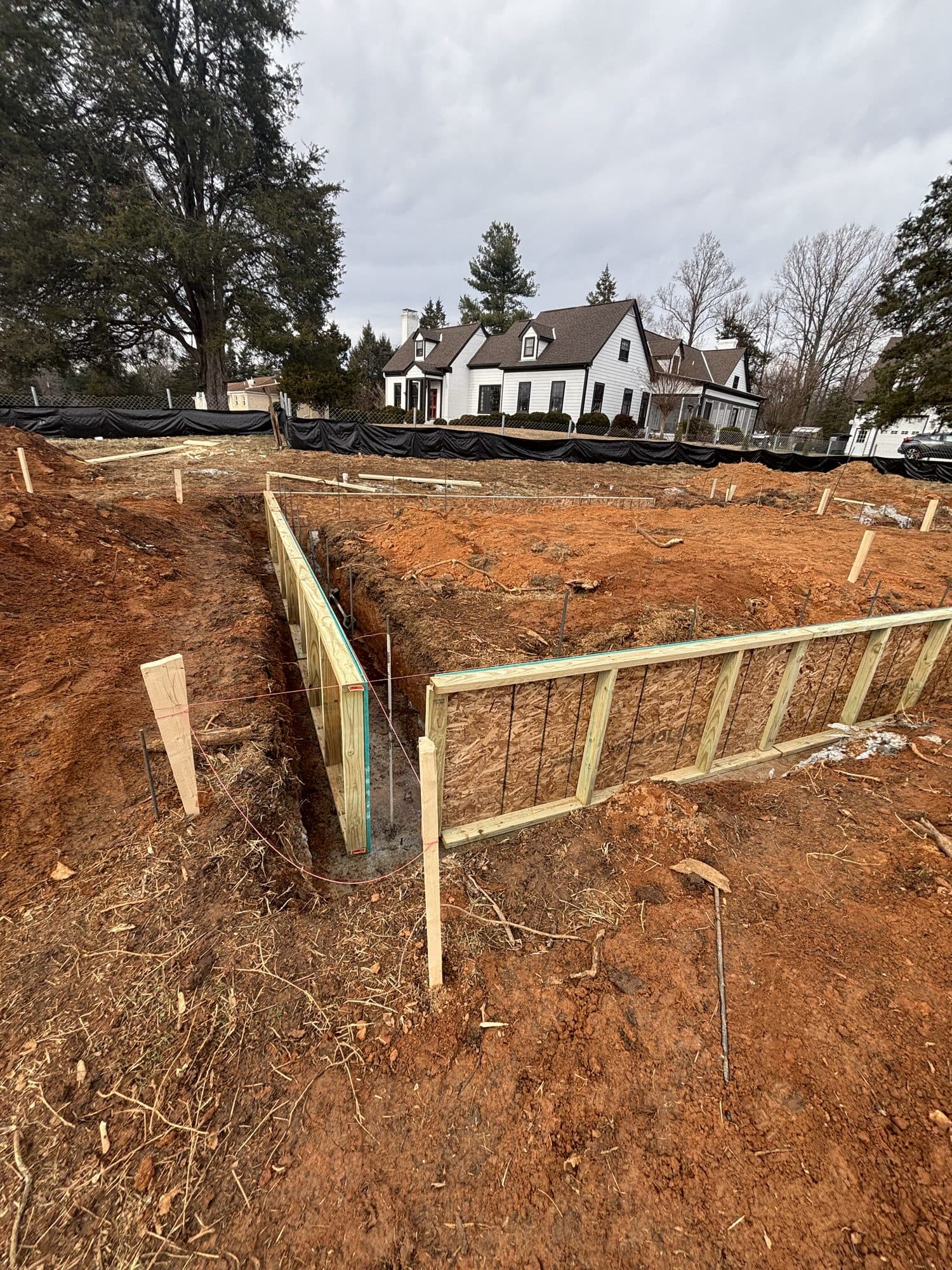 Footing trench with rebar and formwork on graded. Foundation project by Potts Brothers Construction, Arlington & Northern Virginia