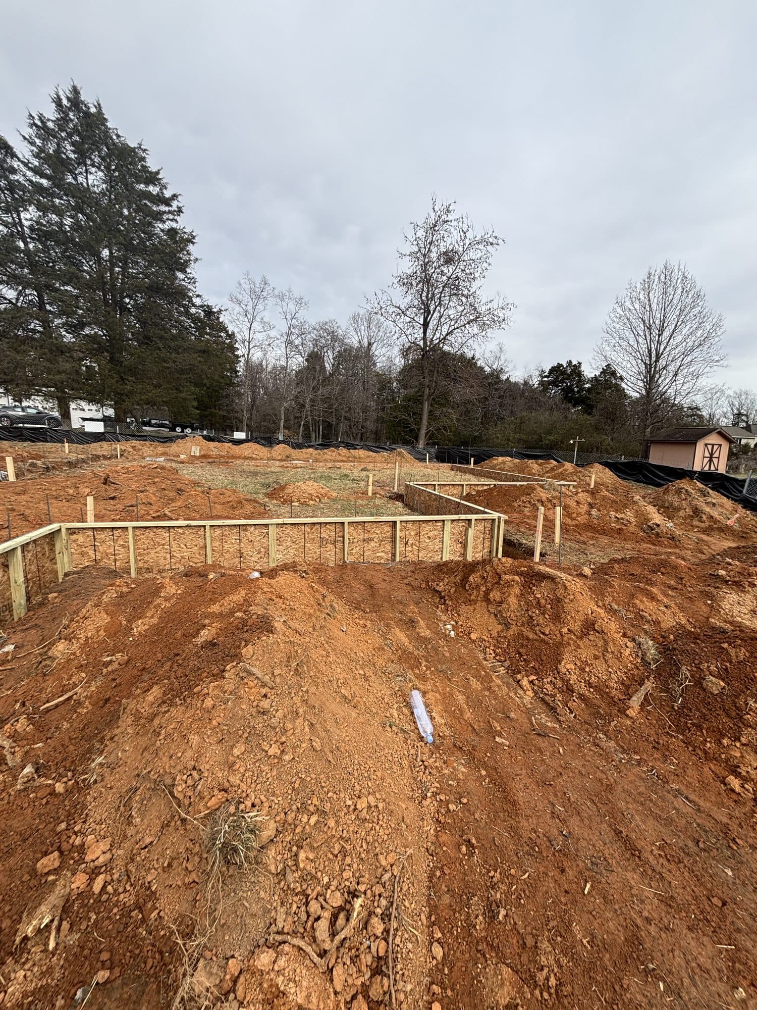 Foundation footing formwork on graded red clay. Foundation project by Potts Brothers Construction, Arlington & Northern Virginia