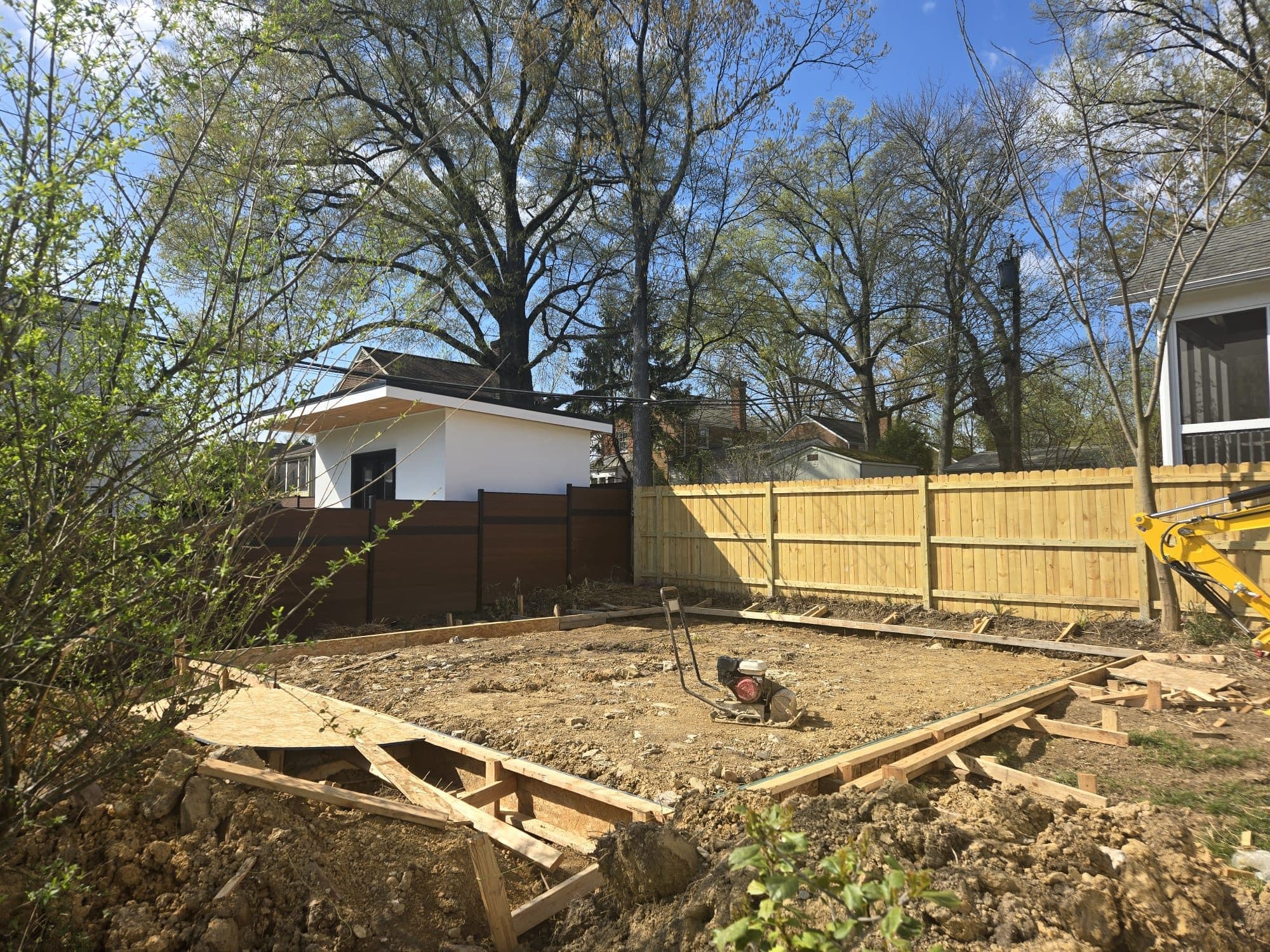 Graded backyard lot with wood forms for slab. Foundation project by Potts Brothers Construction, Arlington & Northern Virginia