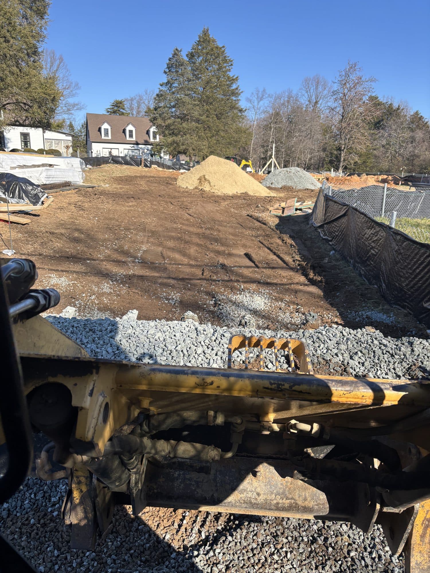 Graded building pad with gravel base and silt. Foundation project by Potts Brothers Construction, Arlington & Northern Virginia